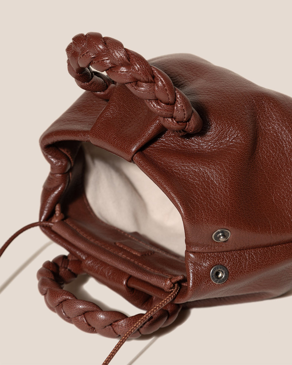 BOMBON SUPPLE SHINY - Plaited-handle Leather Handbag | Hereu US