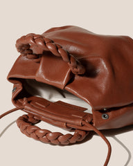 BOMBON M SUPPLE SHINY - Medium Plaited-handle Leather Handbag | Hereu outlet